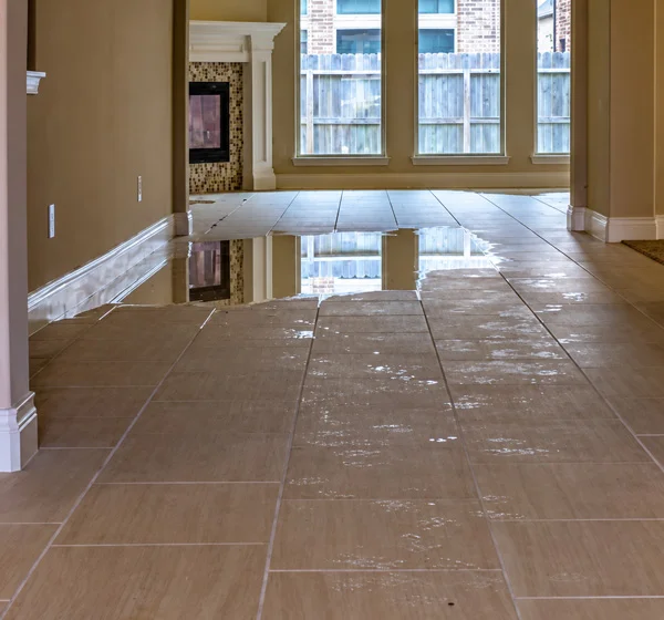 Standing water throughout residential property after flooding