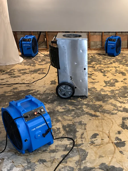 Professional drying equipment operating after water damage cleanup